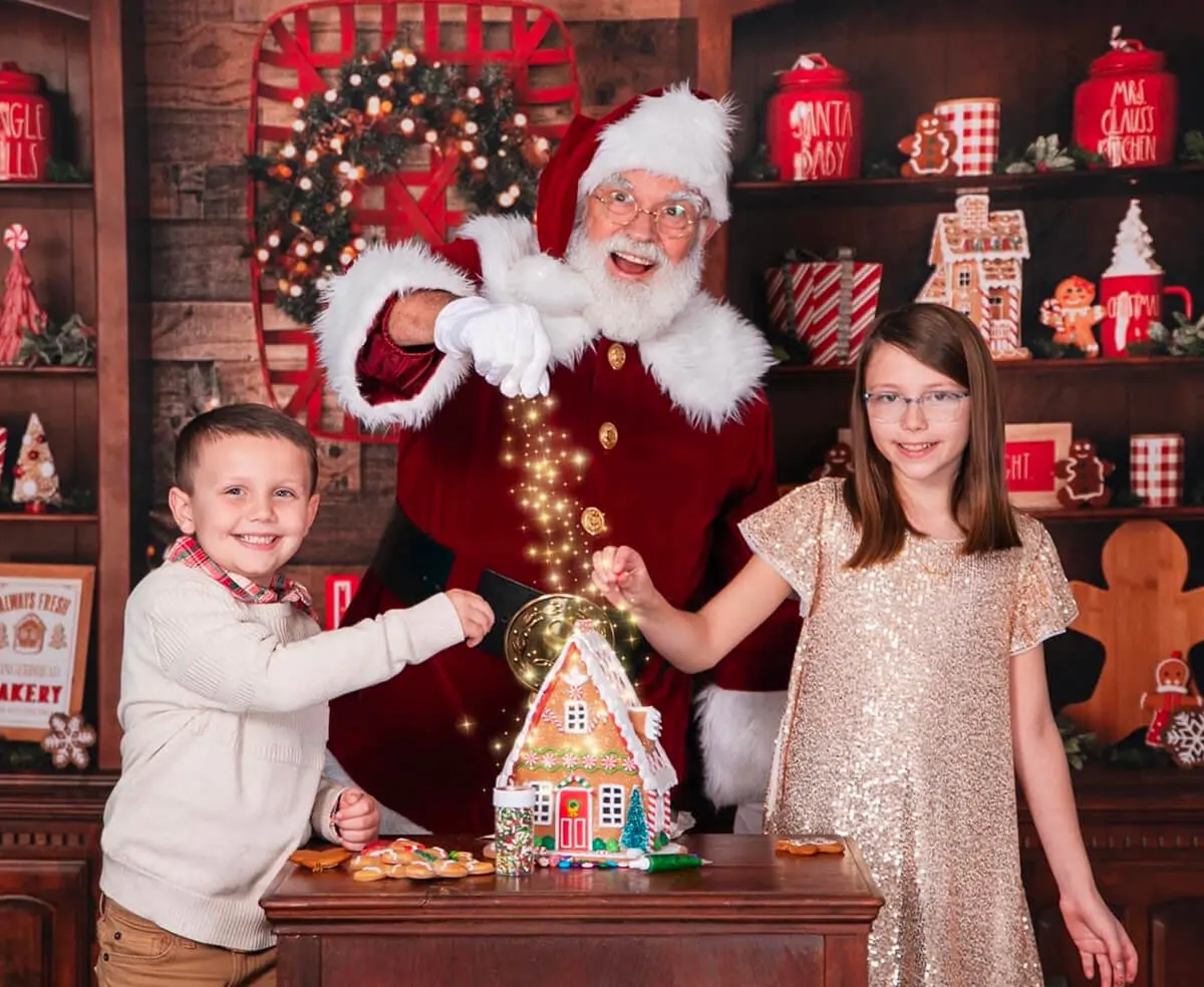 Santa and kids with a gingerbread house.