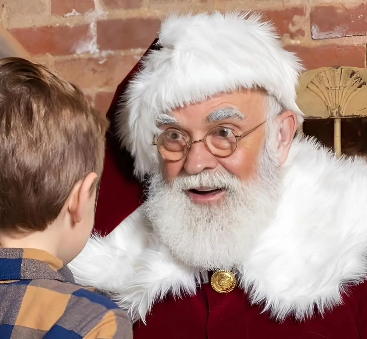 Santa Claus talking to a young boy.