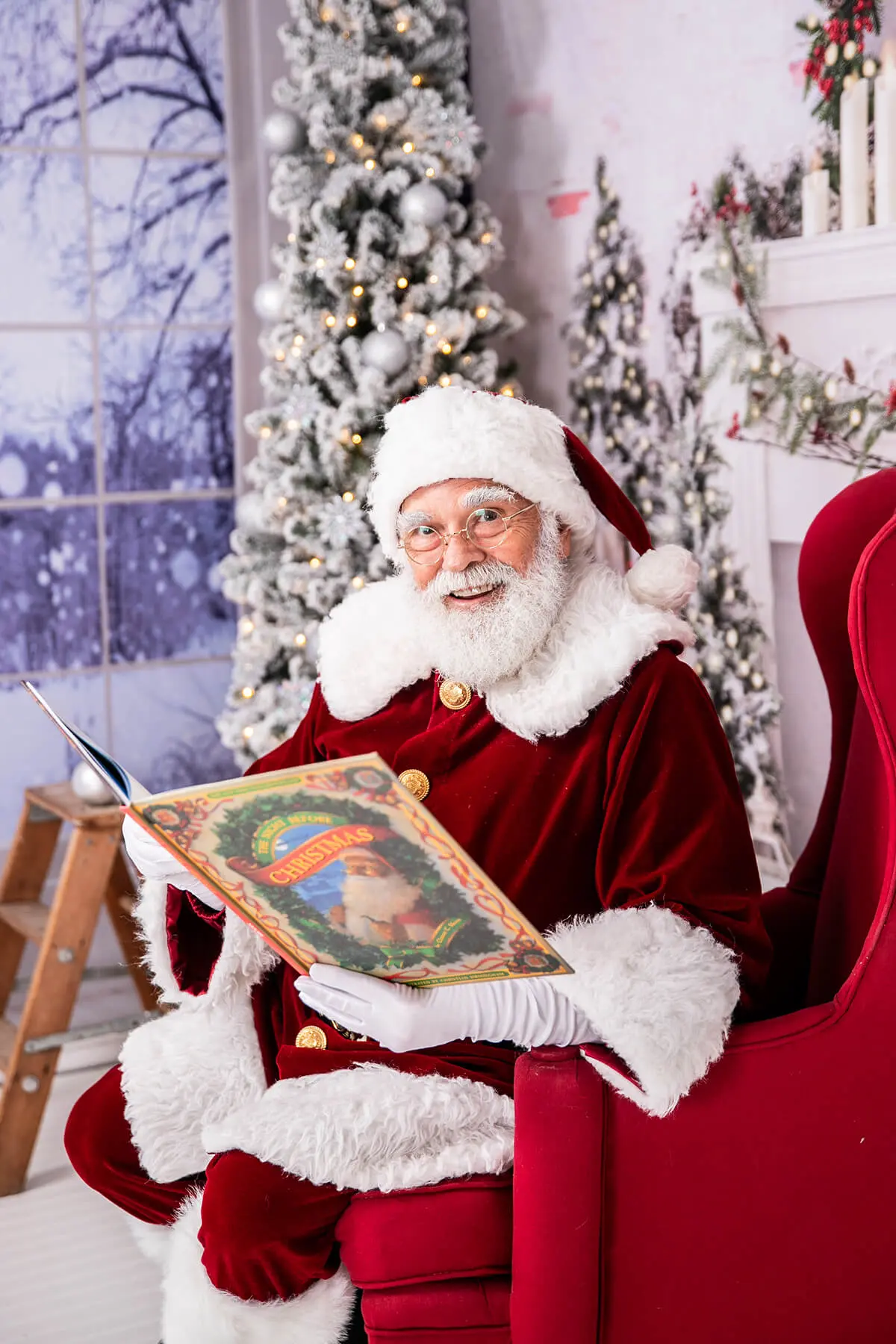 Santa reading a book in festive room.