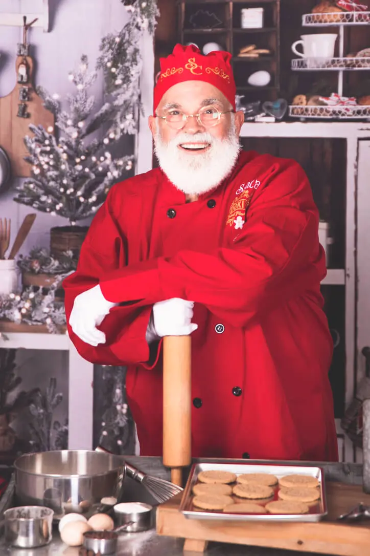 Santa Claus baking cookies in festive kitchen. Santa Claus baking cookies in festive kitchen.